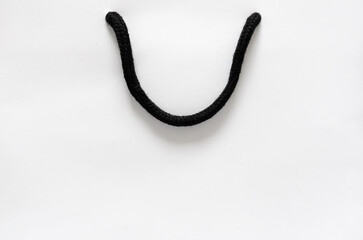 White shopping paper bag for Black Friday shopping sale concept.