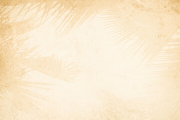 Blurred shadow from leaves plants on the beige concrete wall. Transparent blurry shadow of tropical natural leaves sunlight. Minimal abstract background for product presentation. Spring and summer.