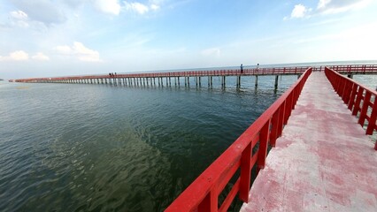 Red bridge boardwalk famous landmark of travel in Samut Sakhon province. 