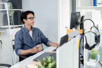 Male office worker, Working on analyzing statistics charts, Accounting officer work financial graphs with computer, HR officers make presentations for employees in organization.