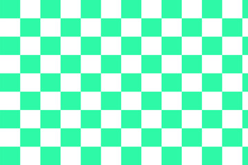 a close-up of a green and white checkered chess board. The board is made of a smooth, wooden surface. The squares are equal in size and are arranged in an eight-by-eight grid.