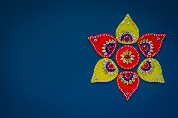 Diwali festival decorative object that can put with diwa lamp for decoration on blue background. - obrazy, fototapety, plakaty