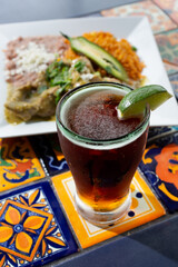 A view of a dark Mexican pilsner beer in a glass.