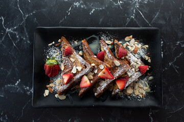 A top down view of a plate of French toast.