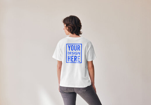 Mockup of woman wearing t-shirt with customizable color and design, rear view