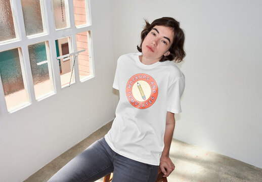 Mockup of woman wearing t-shirt with customizable color and design, high angle, camera flash