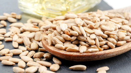 sunflower seeds with a bottle of sunflower oil