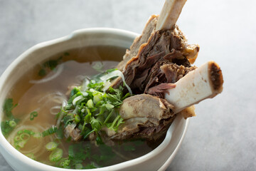 A view of a bowl of back ribs pho.