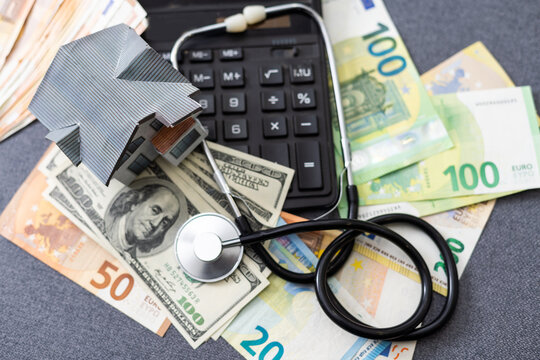 Stethoscope - photo on money bank notes. Medical stethoscope is laying on money bank notes. Dollar and Euro banknotes as background for doctor gadget. Financial health concept. Expensive medicine.