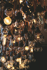 A view of dim retro lightbulb fixtures hanging from rope.