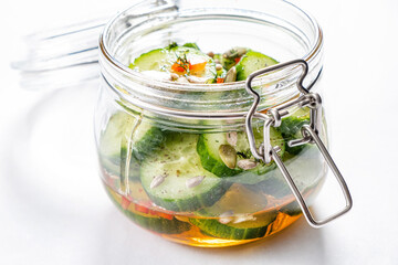 Jar with tasty fermented cucumbers