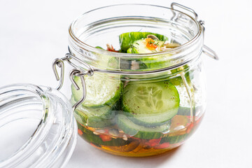 Jar with tasty fermented cucumbers