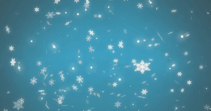 White christmas snowflakes and light particles moving across blue background