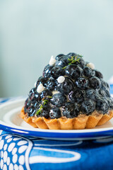 Homemade blueberry tart with soft cheese