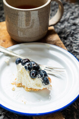 Homemade blueberry tart with soft cheese