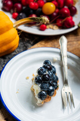 Homemade blueberry tart with soft cheese