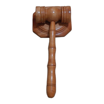 A wooden judge gavel and soundboard