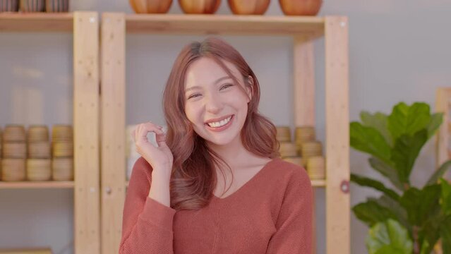 Portrait of happy beautiful business asian woman look at camera smile with positive emotional.Smart confident freelance woman smiling happiness with work at home. Small Business Concept
