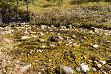 walking along the bed of a mountain river with a visit to unknown places