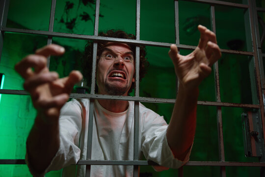 Mentally unstable male patient with attack of rabies locked in cage ward