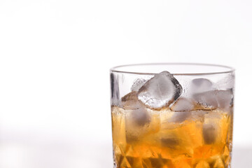 whiskey in a glass filled with ice cubes
