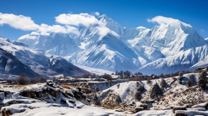 A sweeping vista capturing the snow-covered peaks of Upper Mustang within the breathtaking Annapurna Nature Reserve, highlighting a trekking path in the rugged terrain of Nepal - obrazy, fototapety, plakaty