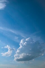 Beautiful blue sky with white clouds. Cumulus and cirrus clouds, fine weather, day
