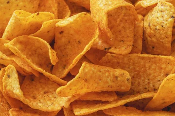 Fotobehang Close-up of a stack of cheese-flavored corn chips © fotosenukas
