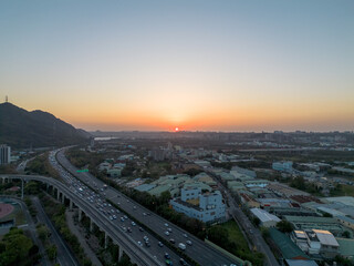 Aerial view of Sanxia District with cars on highway during sunset in New Taipei City, Taiwan.