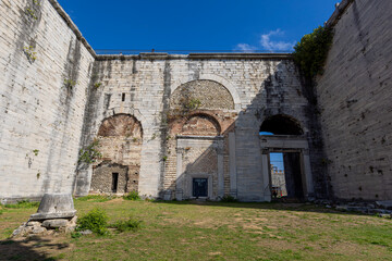 Fototapeta na wymiar Yedikule Dungeons, also known as the Yedikule Fortress, is the golden gate at the junction of the Byzantine land walls. It is an important historical and touristic symbol of Istanbul on a sunny day
