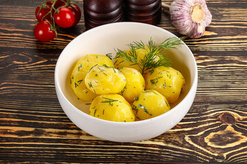 Boiled potato with oil and dill