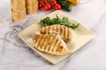Grilled chicken breast served arugula