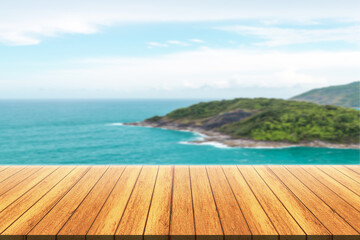 Empty wooden floor for product display montages with sea and mountain background. 