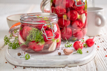 Homemade pickled radishes with garlic, dill and allspice.