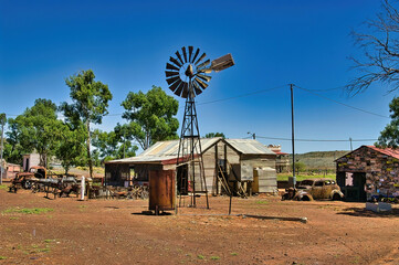 House made of corrugated iron, rusty old cars and a windmill in Gwalia ghost town in the Great...