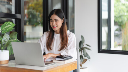 Businesswomen using laptop to typing financial data and working about new startup in outside office