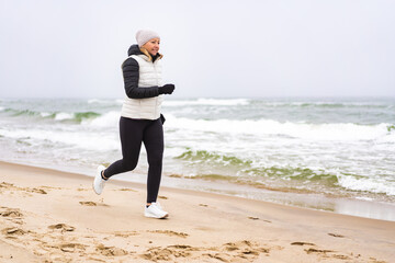 Beautiful woman running on beach