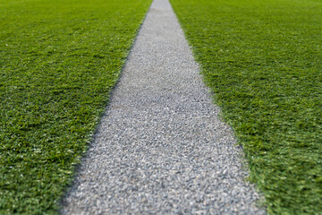 Artificial turf background. Landscaping of the yard with artificial turf. Artificial turf of Soccer football field.  - obrazy, fototapety, plakaty