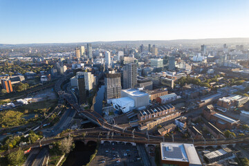 Fototapeta premium Manchester City Centre Drone Aerial View Above Building Work Skyline Construction Blue Sky 2023 Deansgate