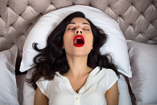 Woman experiences ecstasy on the bed. Sexual satisfaction concept. Generative Ai.