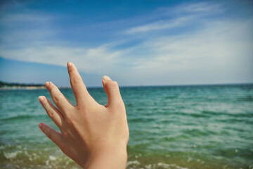 hand on the beach