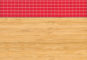 Red white plaid napkin on bamboo wooden floor table or cutting board