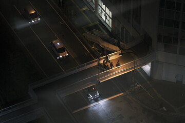 Looking down at the night streets with few pedestrians © EnzoKin