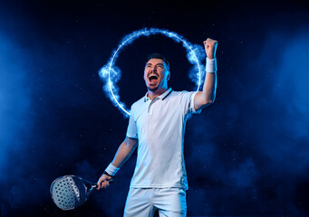 Padel tennis player with racket. Man athlete with paddle racket on court with neon colors. Sport concept. Download a high quality photo.