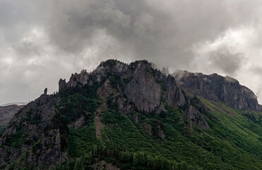 Mountain peak in dramatic clouds and mist, Tongass national forest, Misty Fjords national monument, Alaska, USA.