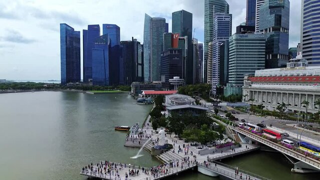 Aerial 4k drone footage of Merlion, the iconic lion mermaid statue in Merlion Park, Singapore.