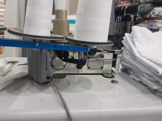 Professional sewing machine with sewing thread closeup