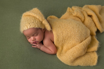 African newborn baby with yellow blanket