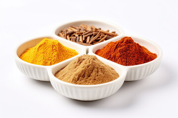 Ground paprika, curry and cinnamon on a white background