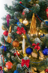 Colorful baubles on christmas tree for background. New Year concept.